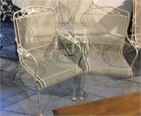 Nice pair of wrought iron patio chairs with leaf