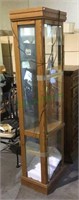 Lighted curio cabinet with glass panel doors and