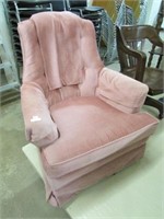 PINK UPHOLSTERED SWIVEL ARM CHAIR