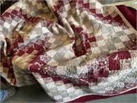 Maroon homemade quilted bed spread