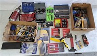 Assortment of calipers, drill bits, and other
