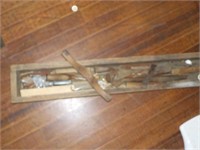 long wooden box  with various early tools