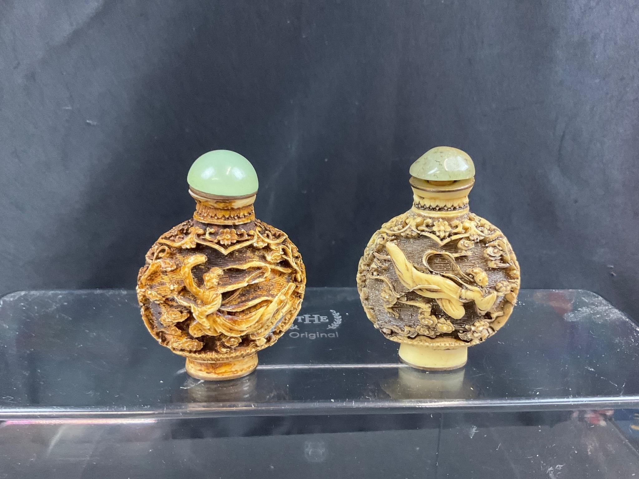 Pair cream Cinnabar hand carved snuff bottles