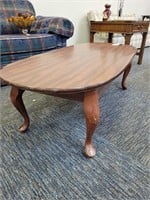 Footed hardwood coffee table