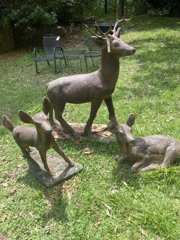 Concrete deer yard statues. Buck’s horns have