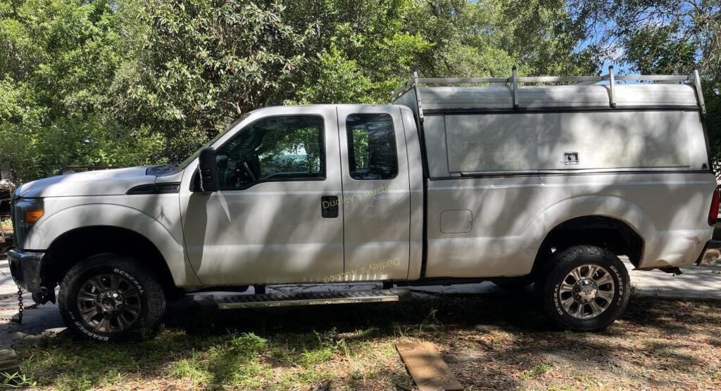2015 Ford F250 with topper & storage, odom reads 7