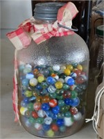 Large vintage jar with zinc lid and marbles with