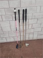 Golf clubs. 2 putters and 2 youth clubs