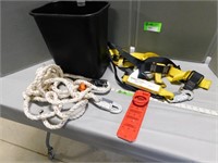 Safety harness, straps and rope in a garbage can