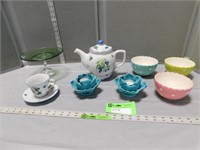 Cake stand, candleholders, tea pot with cup & sauc