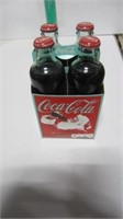 COCA COLA BOTTLES AND CARRIER