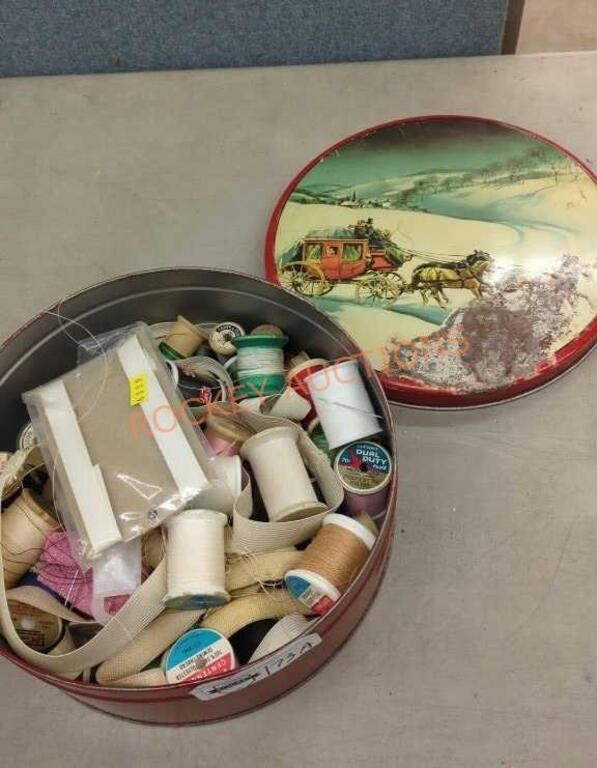 Vintage tin with sewing supplies