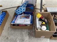 Box of household cleaners, foam sealant, vacuum