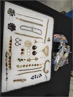 Earring sets, bracelets, pins, and watches