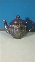 Brown teapot with stone decoration