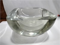 Very heavy glass bowl 8 in wide 5 in deep about