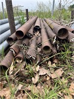 lot of iron pipes, mostly 6 foot, between post