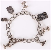 STERLING SILVER CHAINED BRACELET W/ 7 PENDANTS