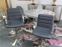 Pair of Grey leather swivel barstools