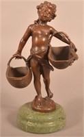 Vintage Bronze Sculpture of a Puti Holding Baskets