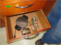 Everything in bottom drawer left of sink