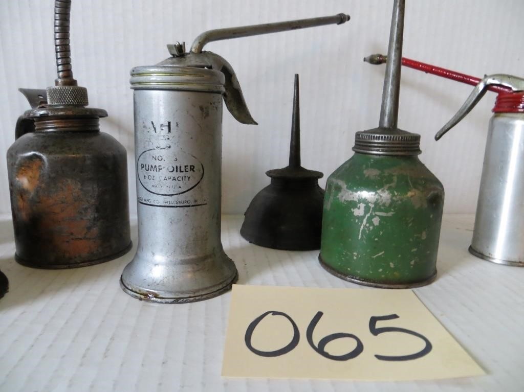 Nine Vintage Oil Cans