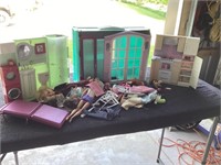 G)  Barbie doll house with dolls and accessories.
