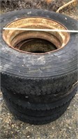 Various truck tires, some with rims