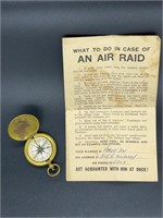 Antique WWII compass and Air Raid notice