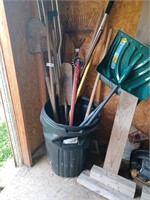 Garbage can full of hand tools