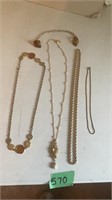 Assorted gold necklaces