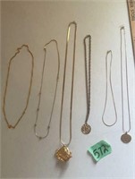 Assorted gold necklaces