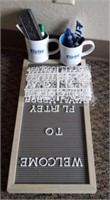 Office supplies and coffee cups, and letter