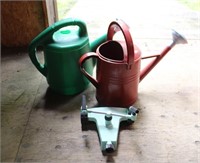 Two plastic watering cans and Melmor sprinkler