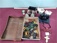 Wood tray, camera, pig jars, letters,