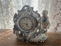 Genuine porcelain clock with glass snowman