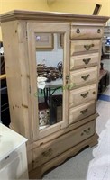 Tall six drawer dresser with a mirror door with