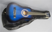 Child's size acoustic guitar with soft case.