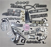 Bunch of Used Car Vehicle Emblems