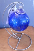 Hand blown glass ornament on stand 9”