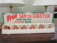 VINTAGE SANTA COCA COLA COASTERS IN DISPLAY