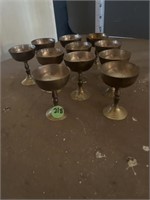11 brass miniature goblets.