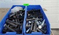 Assorted bolts and screws in plastic containers