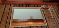 Pretty wood framed mirror approx size is 19 x  26