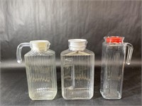 Three Clear Glass Ribbed Pitchers