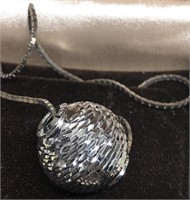 14kt. gold spherial pendant w/diamond cut beads