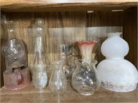 Group of older oil lamp and several glass shades