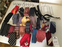 23 men's ties; 2 tie racks; pair of suspenders