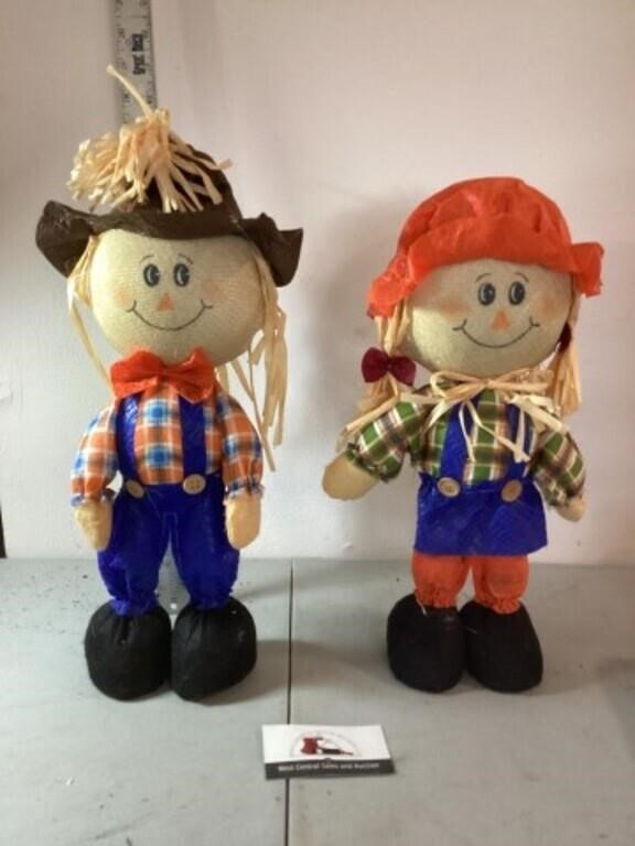 Boy and girl scarecrows