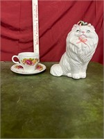 Cat figurine and small cup and plate